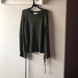 Green sweater with side ties